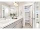Modern bathroom featuring double sinks, vanity, and a walk-in shower at 442 Granite Mill Blvd, Chapel Hill, NC 27516