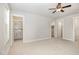 Large bedroom featuring neutral carpet and view into bathroom and walk-in closet at 442 Granite Mill Blvd, Chapel Hill, NC 27516