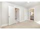 Bedroom featuring neutral carpeting with views into the hall and bathroom at 442 Granite Mill Blvd, Chapel Hill, NC 27516