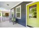 Inviting front porch with a cozy bench, vibrant door, and a relaxing outdoor seating area at 442 Granite Mill Blvd, Chapel Hill, NC 27516