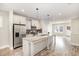 Spacious kitchen with granite counters, stainless steel appliances, and an open design to the adjacent living spaces at 442 Granite Mill Blvd, Chapel Hill, NC 27516