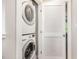 Convenient laundry area with a stacked washer and dryer unit inside a closet at 442 Granite Mill Blvd, Chapel Hill, NC 27516