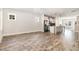 Open-concept living space with wood floors seamlessly connecting the living area and modern kitchen at 442 Granite Mill Blvd, Chapel Hill, NC 27516