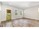 Bright living room with hardwood floors, ample natural light, and a stylish exterior door at 442 Granite Mill Blvd, Chapel Hill, NC 27516