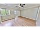 Bedroom showcasing hardwood floors, a sliding closet door and a ceiling fan at 4736 Walden Pond Dr, Raleigh, NC 27604