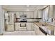 Modern kitchen featuring stainless steel appliances and sleek countertops for a contemporary feel at 4736 Walden Pond Dr, Raleigh, NC 27604