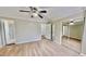 Spacious main bedroom featuring a ceiling fan, hardwood floors, and ensuite bathroom at 4736 Walden Pond Dr, Raleigh, NC 27604
