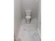 Clean, well-lit toilet room featuring a toilet with marble tile flooring and partial view of shower at 4736 Walden Pond Dr, Raleigh, NC 27604
