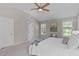 Spacious bedroom featuring neutral walls, carpet, ceiling fan, and an ensuite bathroom, offering a serene retreat at 4804 Carmen Ln, Durham, NC 27707