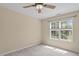 Bright bedroom with a ceiling fan and natural light, creating a comfortable and inviting space at 4804 Carmen Ln, Durham, NC 27707