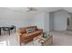 Bedroom features angled ceiling, a leather sofa with chest and a black table with chairs at 4804 Carmen Ln, Durham, NC 27707