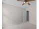 Bright bedroom features a ceiling fan, a window and carpeted floors to create a welcoming retreat at 4804 Carmen Ln, Durham, NC 27707