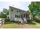 Exterior of the property with well-maintained lawn, deck and screened in back porch at 4804 Carmen Ln, Durham, NC 27707