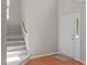Entryway with a staircase and front door features hardwood floors at 4804 Carmen Ln, Durham, NC 27707