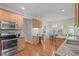 Spacious kitchen with stainless steel appliances, light cabinets, and breakfast nook area at 4804 Carmen Ln, Durham, NC 27707