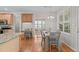 Open kitchen with breakfast nook and views of the breakfast table with natural light at 4804 Carmen Ln, Durham, NC 27707