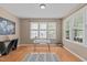 Bright office with hardwood floors, modern desk, and natural light from windows at 4804 Carmen Ln, Durham, NC 27707
