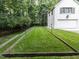 Expansive backyard with a lush green lawn at 5005 Lenoraway Dr, Raleigh, NC 27613