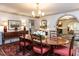 Elegant dining room with traditional décor, hardwood floors, and ample natural light at 5005 Lenoraway Dr, Raleigh, NC 27613