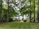 Well-manicured front yard with a white home at 5005 Lenoraway Dr, Raleigh, NC 27613