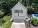 Detached garage with ample parking space and additional storage above, complementing the main residence at 5005 Lenoraway Dr, Raleigh, NC 27613