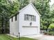 Detached garage with guest suite above overlooking an inground pool and backyard at 5005 Lenoraway Dr, Raleigh, NC 27613