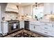 Stylish kitchen features white cabinetry, stainless steel appliances and lots of natural light at 5005 Lenoraway Dr, Raleigh, NC 27613