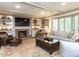Inviting living room with a fireplace, built-in shelves, and comfortable seating area at 5005 Lenoraway Dr, Raleigh, NC 27613