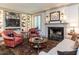 Cozy living room with fireplace, built-in shelving, and comfortable seating arrangement at 5005 Lenoraway Dr, Raleigh, NC 27613