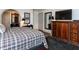 Well appointed main bedroom featuring a plaid comforter and plenty of closet space at 5005 Lenoraway Dr, Raleigh, NC 27613