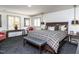 Spacious main bedroom with patterned carpet, neutral walls, and a large bed at 5005 Lenoraway Dr, Raleigh, NC 27613