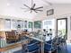 Relaxing screened porch with comfortable seating and a ceiling fan at 5005 Lenoraway Dr, Raleigh, NC 27613