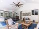 Covered porch featuring a dining table, lounge area, and airy atmosphere for outdoor living at 5005 Lenoraway Dr, Raleigh, NC 27613