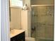 Bathroom featuring a shower with glass doors, a vanity, and neutral decor at 503 N Franklin Dr, Sanford, NC 27330