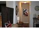 Hallway with a decorative screen, an oval mirror, and artwork adding a touch of elegance at 503 N Franklin Dr, Sanford, NC 27330