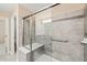 Bathroom featuring a glass shower with a built-in bench seat and tiled walls at 507 Brier Crossings Loop, Durham, NC 27703