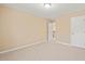 Bedroom featuring neutral walls and carpet flooring with access to the stairway at 507 Brier Crossings Loop, Durham, NC 27703