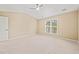 Light-filled bedroom with neutral walls, carpet flooring, and a ceiling fan at 507 Brier Crossings Loop, Durham, NC 27703