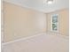 Neutral bedroom featuring plush carpet, one window with blinds and natural light at 507 Brier Crossings Loop, Durham, NC 27703
