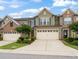 Townhome featuring a two-car garage, green siding and a well maintained yard at 507 Brier Crossings Loop, Durham, NC 27703