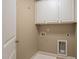 Neutral laundry room with white cabinets above the laundry connections at 507 Brier Crossings Loop, Durham, NC 27703