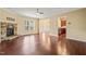 Bright living room features hardwood flooring, a fireplace, and an open-concept layout at 507 Brier Crossings Loop, Durham, NC 27703