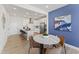 Modern dining area featuring a stylish table, chairs, and an open layout connecting to the kitchen at 509 Kildaire Farm Rd # 106, Cary, NC 27511