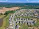 New suburban living Primary-planned community featuring ponds, tree-lined streets, and new construction homes with green spaces at 525 Willow Breeze Ct, Zebulon, NC 27597