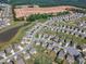 Aerial view of a Primary-planned community with new construction, ponds, and tree-lined streets for suburban living at 525 Willow Breeze Ct, Zebulon, NC 27597