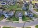 Aerial view of a neighborhood with well-maintained lawns and neatly arranged homes at 525 Willow Breeze Ct, Zebulon, NC 27597