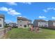 The fenced backyard features a fire pit area and lounge space, perfect for entertaining at 525 Willow Breeze Ct, Zebulon, NC 27597