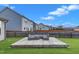 Backyard features a wooden deck with lounge seating and a wooden perimeter fence at 525 Willow Breeze Ct, Zebulon, NC 27597