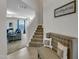 Inviting entryway with staircase access, a comfortable bench and a view into the cozy living area at 525 Willow Breeze Ct, Zebulon, NC 27597