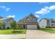 Beautiful two-story home with a well-manicured lawn, and convenient two-car garage, perfect for Gathering living at 525 Willow Breeze Ct, Zebulon, NC 27597